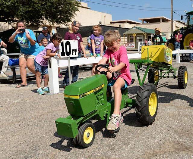 Kids ages 4 through 12 are invited to test both their tractor driving skills and their leg power as they compete to win prizes, while the crowd cheers at the Kid’s Pedal Tractor Pulls located in @UnitedAgAndTurf Plaza. #BigTex #StateFairofTX